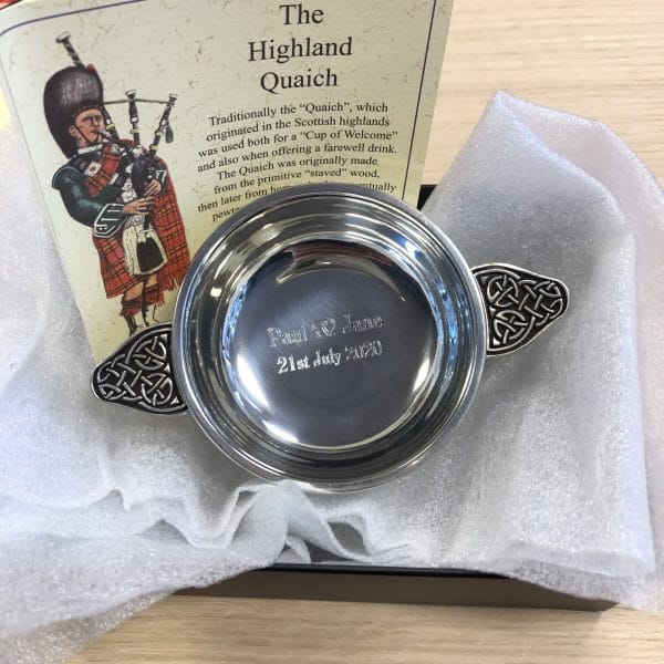 Image of Personalised Engraved Scottish Quaich Pewter Celtic Handle on display
